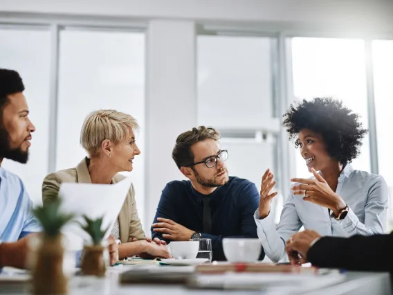 I need everyone to give me their best ideas. Shot of a group of businesspeople sitting together in a meeting.