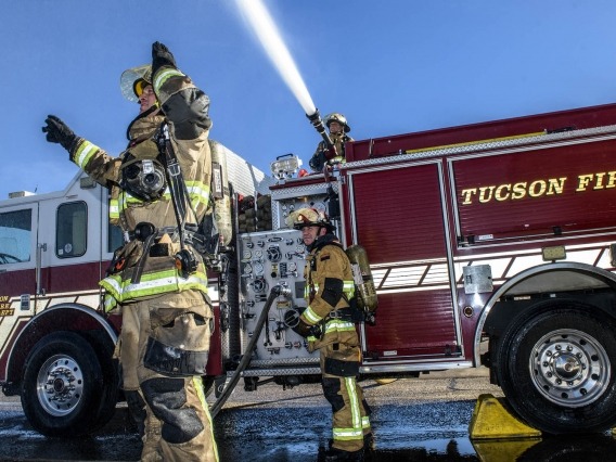 firefighters working around a firetruck